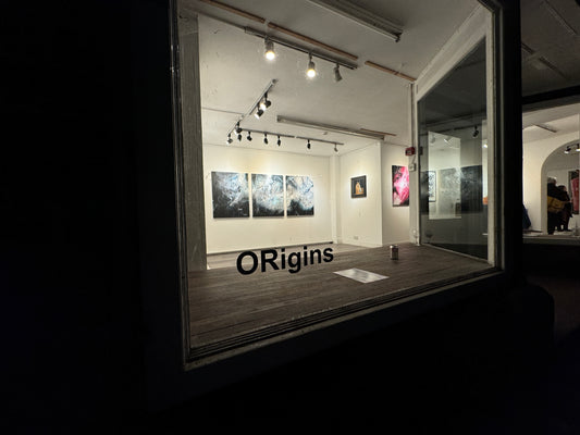 Art exhibition at Repton School's New Court Gallery featuring abstract and contemporary works, including pieces from the 'Origins' collection, displayed in a modern, well-lit gallery space.